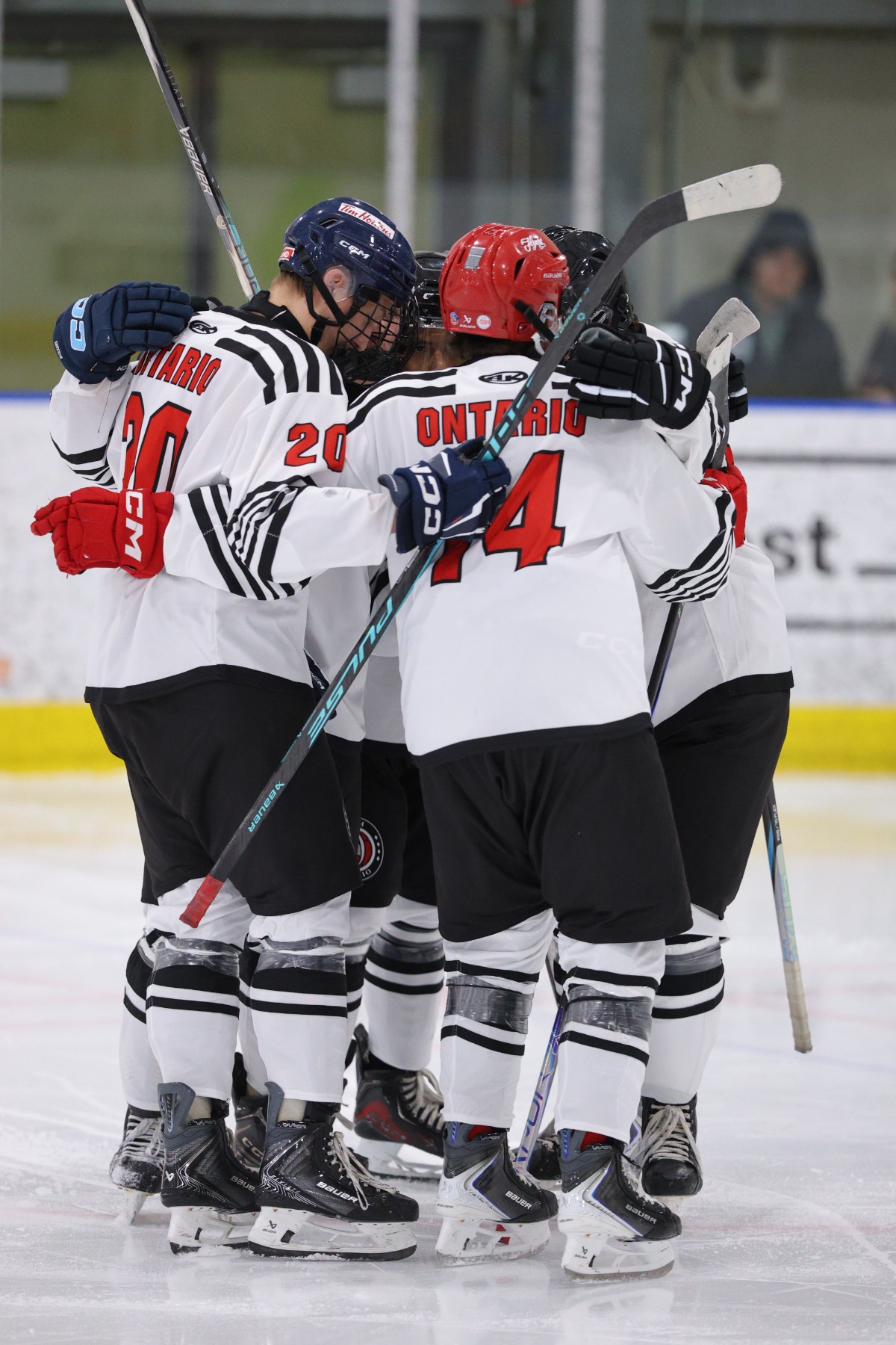 Team Ontario celebrates together on the ice